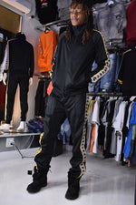 Kappa 222 Banda Dullo tracksuit in black-red-gold