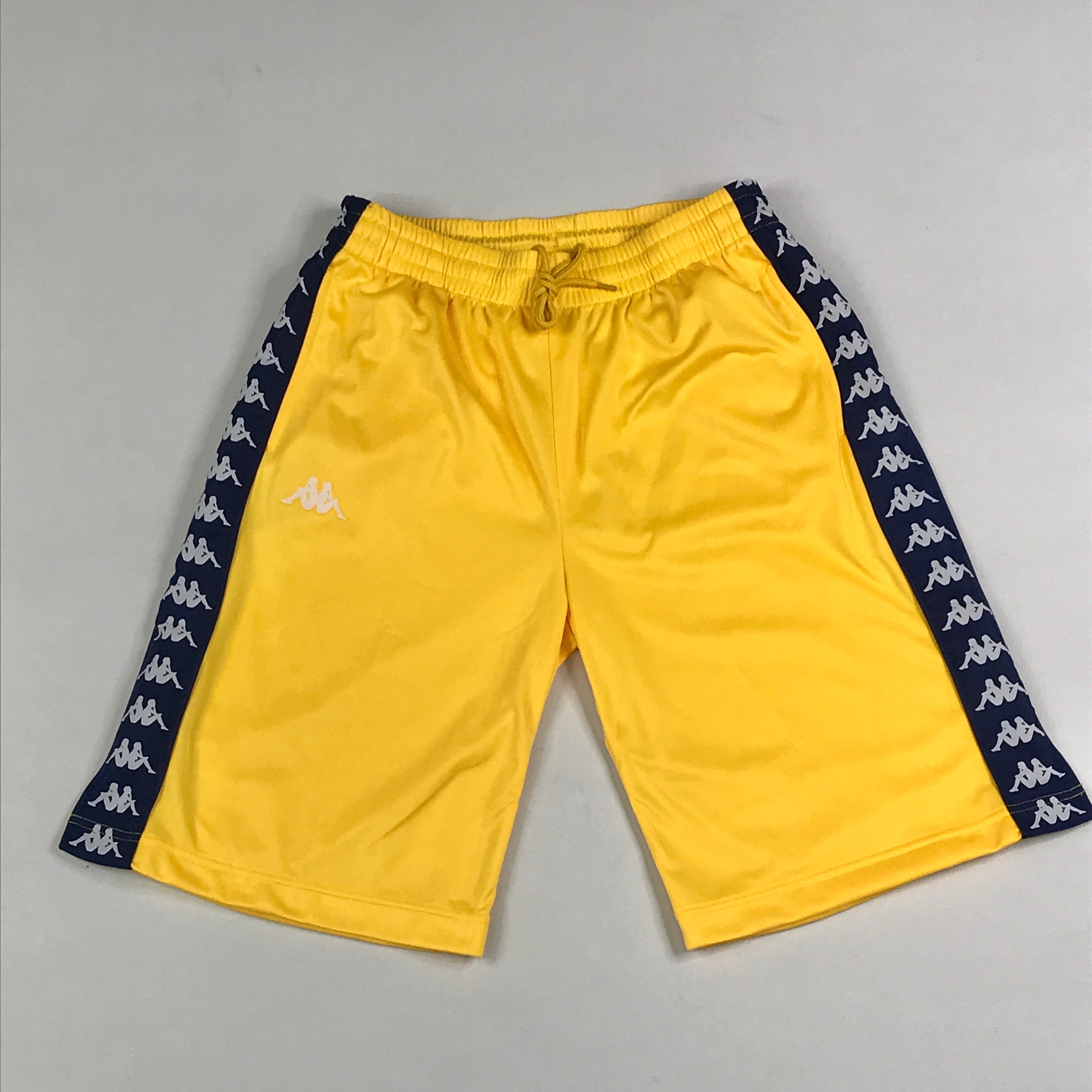 Yellow basketball shorts w/navy kappa strip