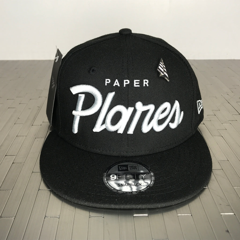 Grey paper planes script on black snapback hat